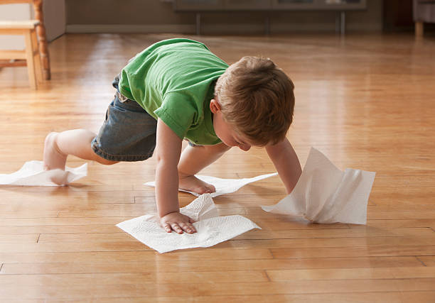 Kid cleaning floor | Vic's Carpet & Flooring
